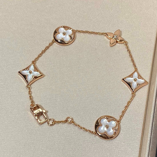 [Elitejewels]STAR AND SUN 5 MOTIF MOP PINK GOLD BRACELET